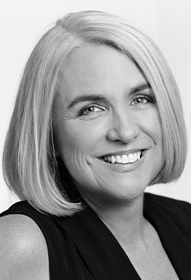 A close-up black and white portrait of Dr Robyn Mildon